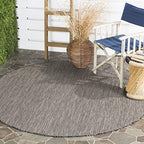 SAFAVIEH Outdoor Round Rug 6'7" by Unknown